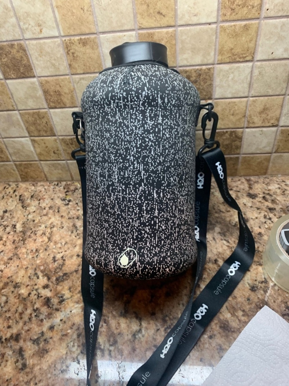 H2O Capsule 2.2L Half Gallon Water Bottle with a protective.